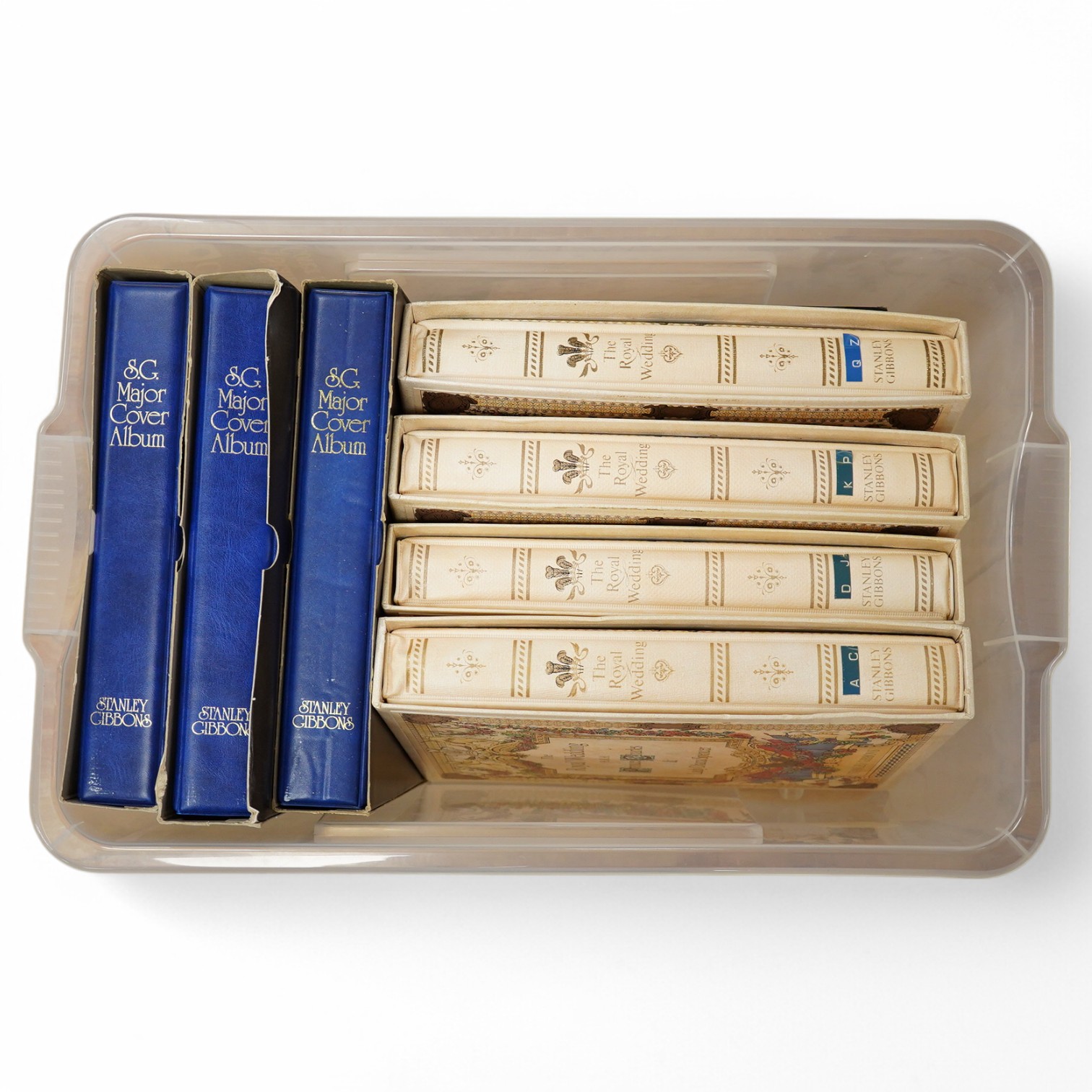 A box containing eight modern stamp albums